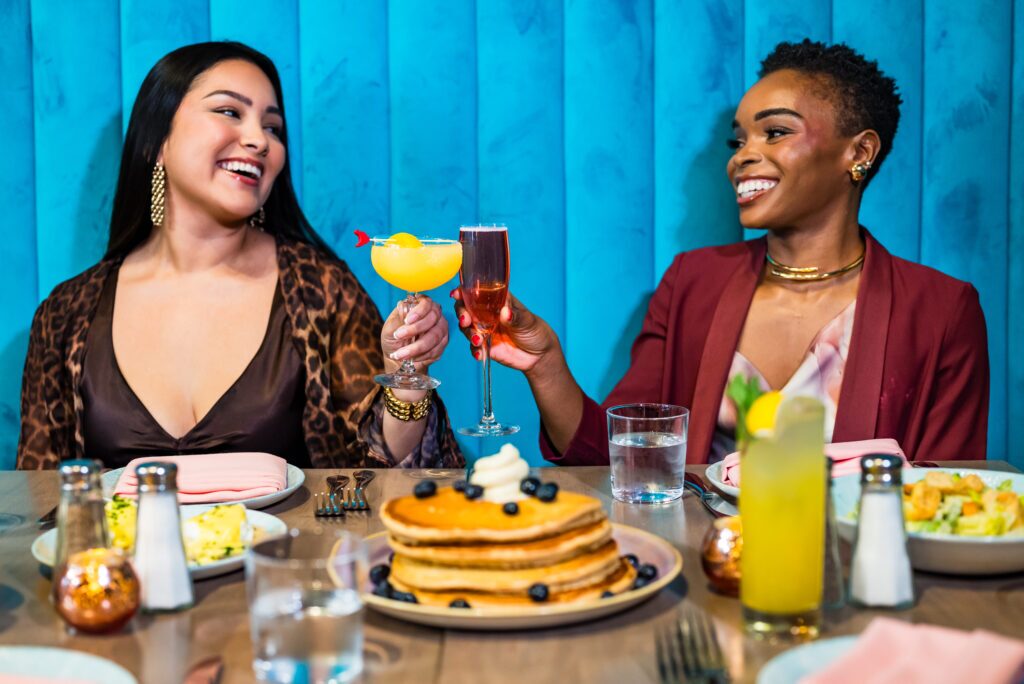 Two Women Enjoying Food