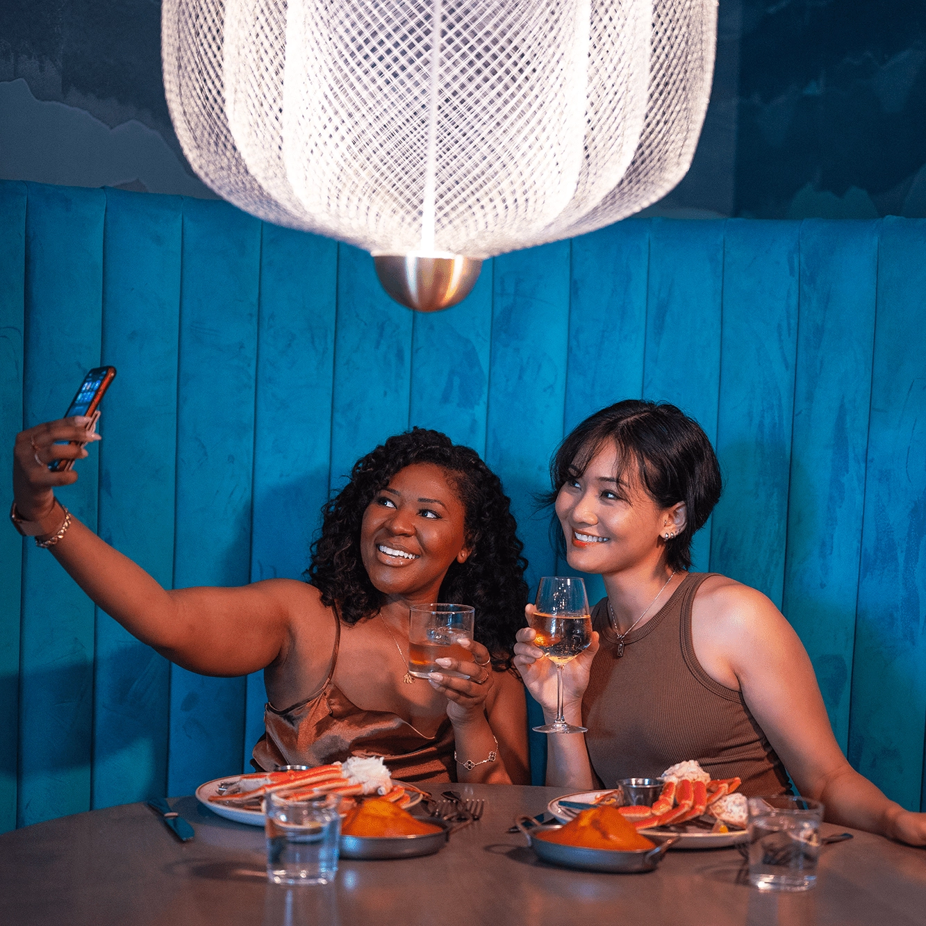 Two women in restaurant for happy hour