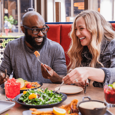 Man and women enjoying drinks together
