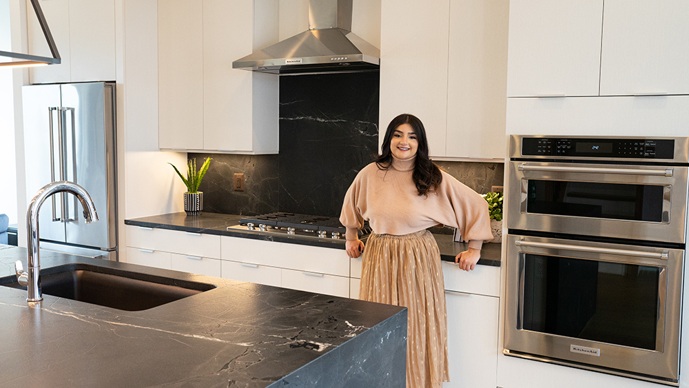Real Estate Agent Posing In Kitchen