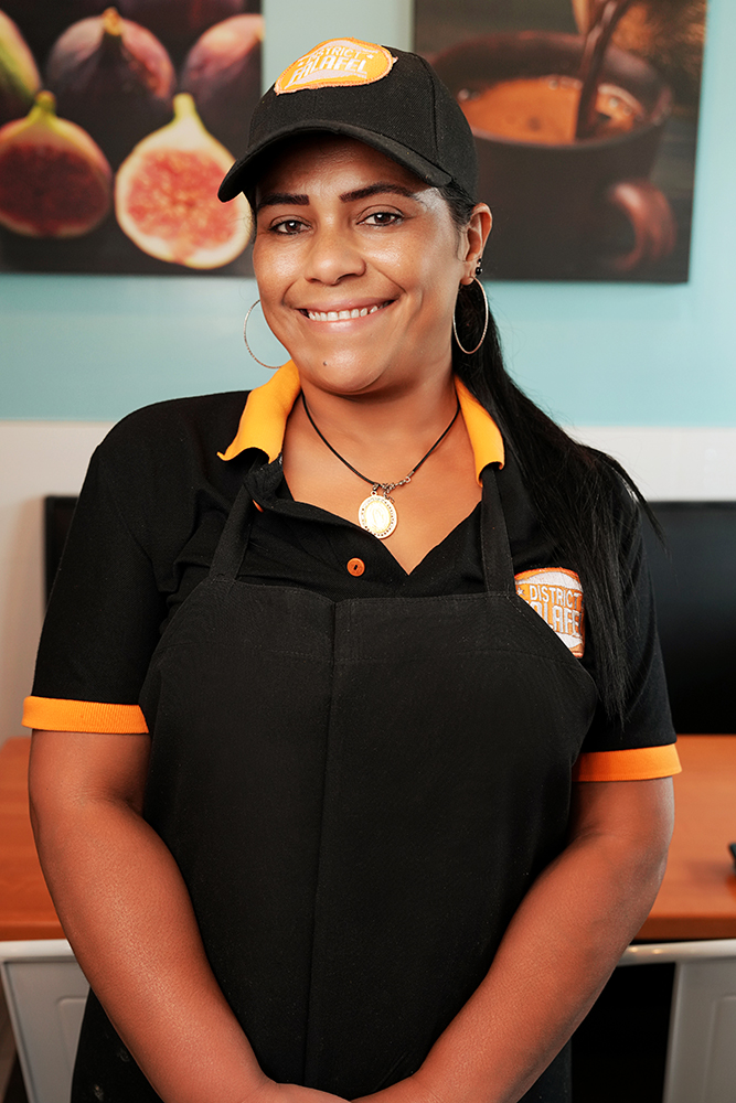 Profile headshot of a female employee at District Falafel