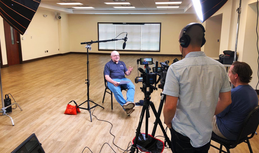 Shooting onset at Own Brown Community Center with professional lights set up for an interview.