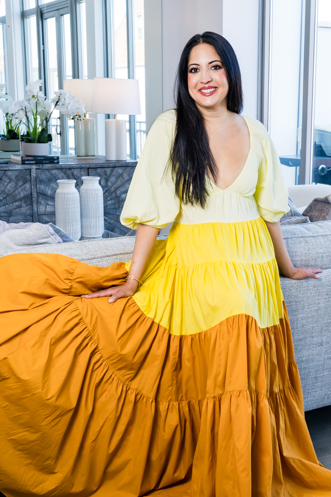 Luxury Real Estate Agent Posing Wearing a Beautiful Dress in a Luxury Apartment