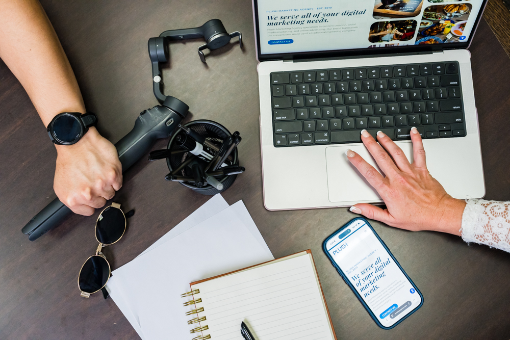 One hand on the laptop and one hand on the video gimbal