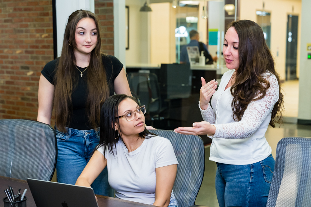 Three Women Meeting About Marketing Strategy