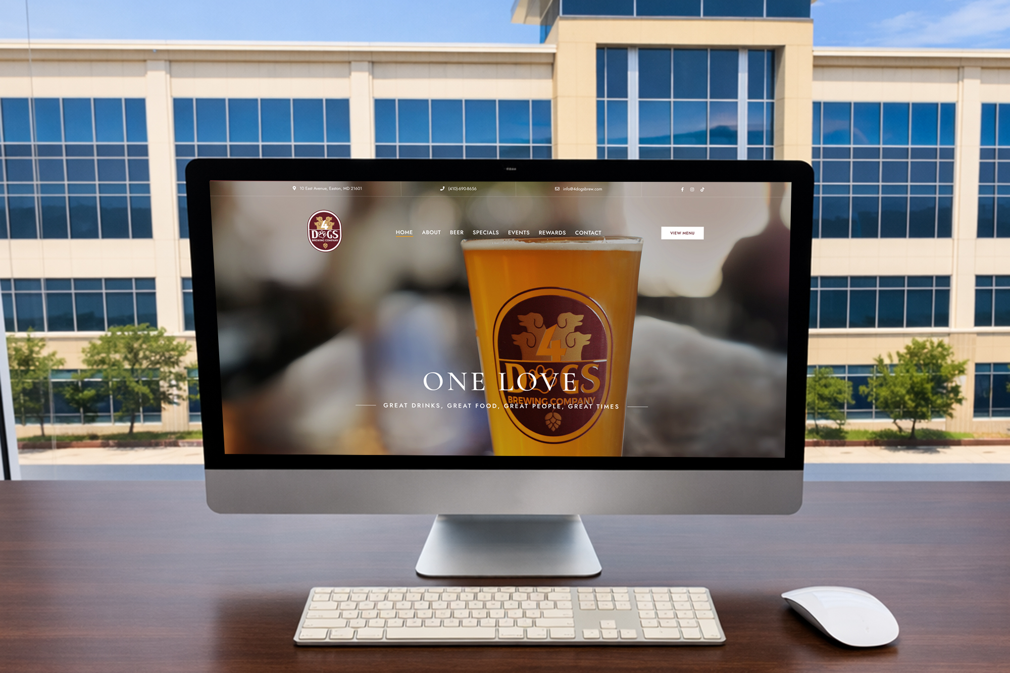 Bar Website Design Services - Computer with homepage looking outside at Maple Lawn