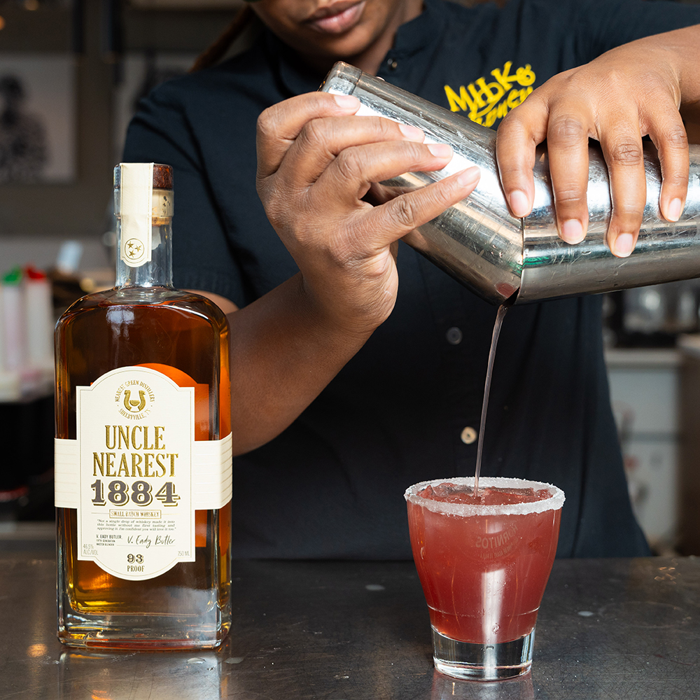 Bartender Pour Cocktail At Restaurant Bar in DC