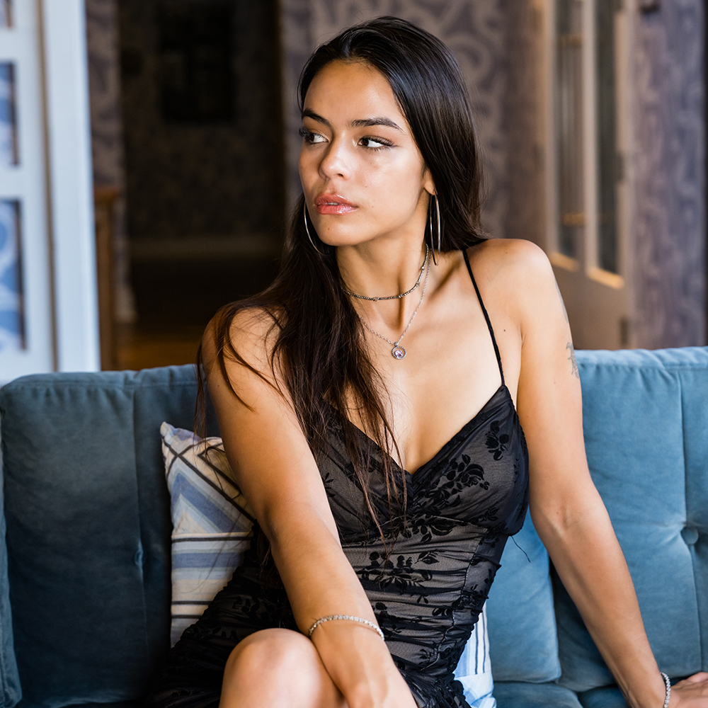Woman Sitting in Hotel Lounge